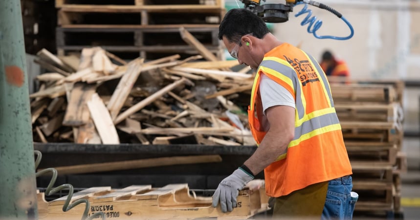 48forty solutions employee completing pallet repair