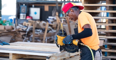 48forty pallet worker repairing a pallet