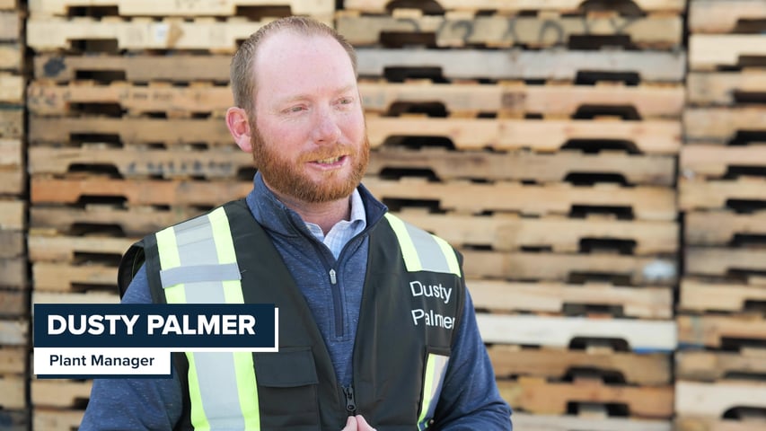 Dusty Palmer Plant Manager speaks in front of pallets